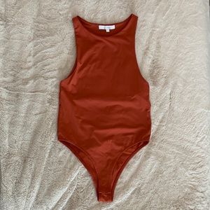 Burnt orange body suit
